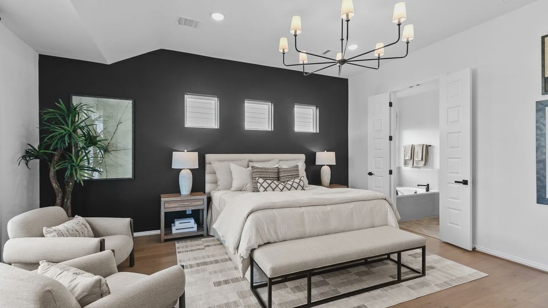Experience luxury with a sleek black accent wall and sophisticated chandelier in River Ranch. Experience luxury with a sleek black accent wall and sophisticated chandelier in River Ranch.