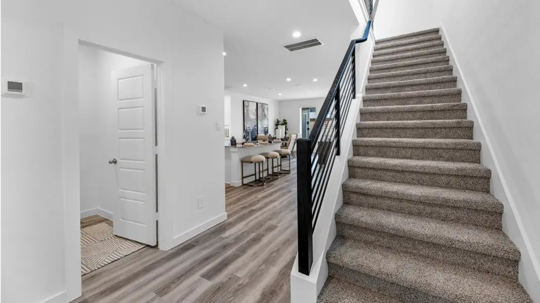 Furnished interior in a model home at Alexander Townhomes in Pearland (Image 8).