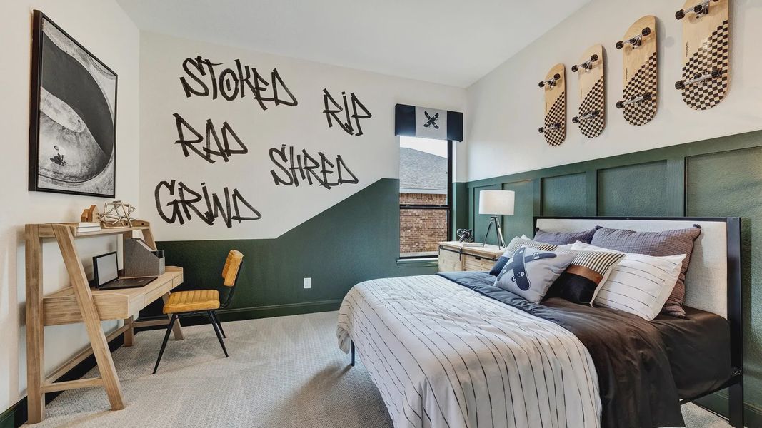 This Hawkes Landing teen room showcases unique skateboard wall art and custom graffiti design.