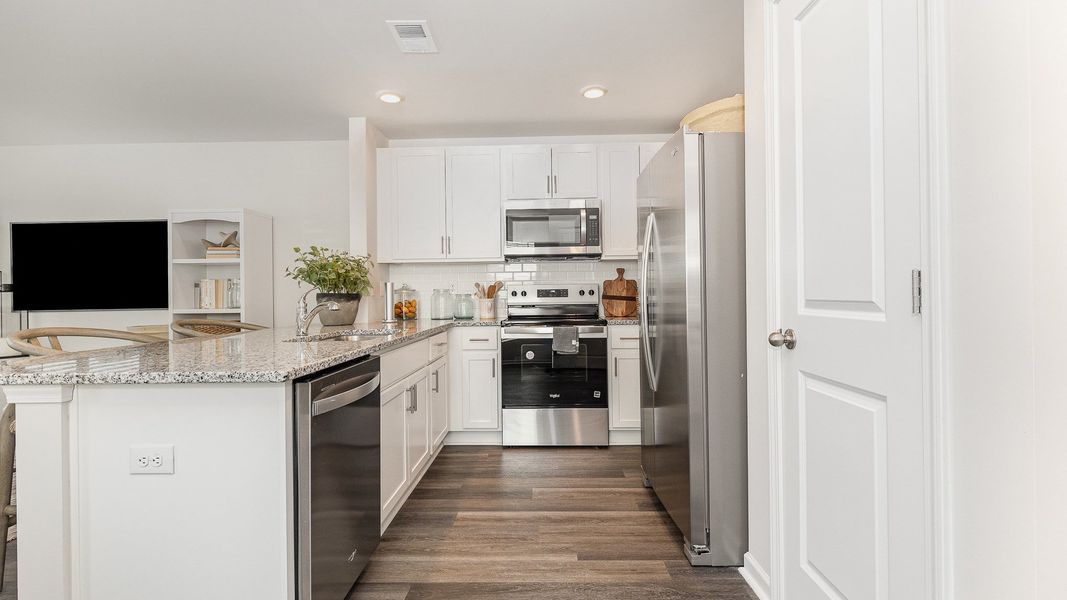 Furnished interior in a model home at The Cove at Glenns Bay in Surfside Beach (Image 5).