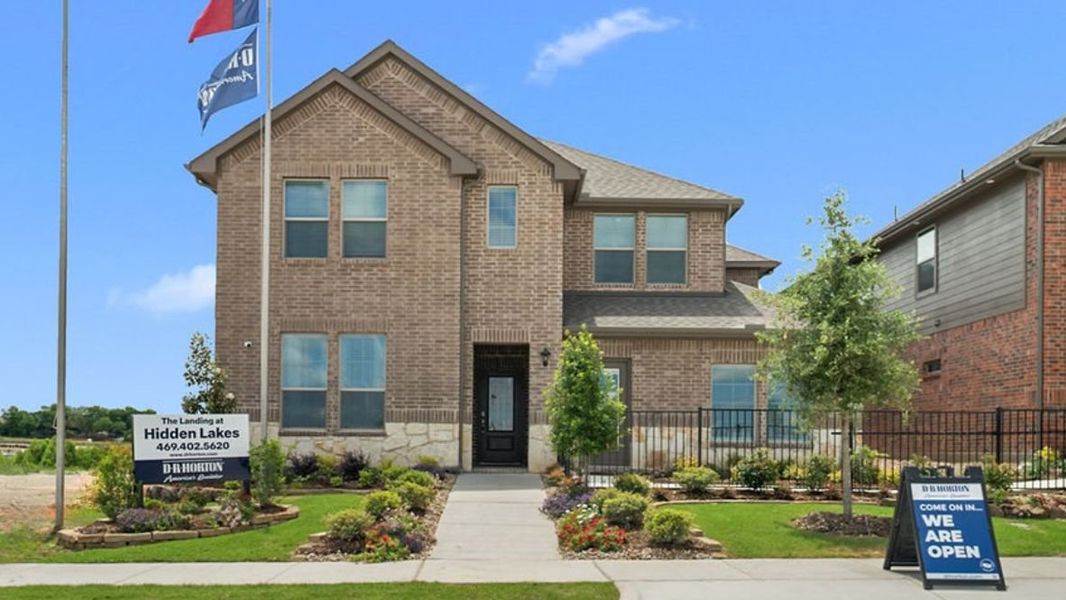 Front exterior of a home in the The Landing at Hidden Lakes community, located in McKinney, TX (Image 1).