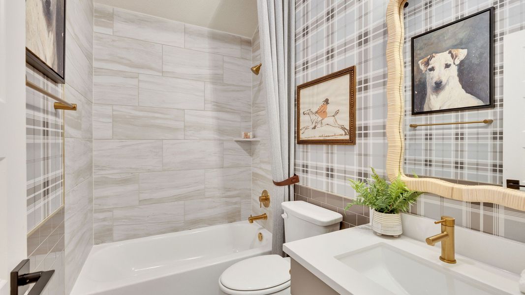 Immerse in luxury; bathroom features exquisite marble tiles and gold accents in Preserve at Lakeside Meadows. Immerse in luxury; bathroom features exquisite marble tiles and gold accents in Preserve at Lakeside Meadows.