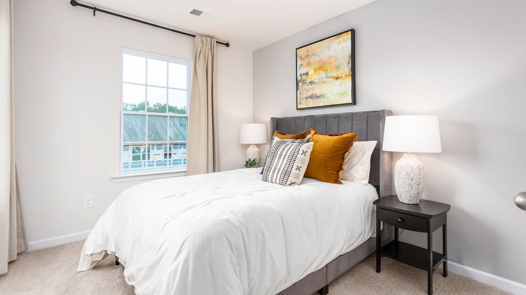 Furnished interior in a model home at North Village Townes in Greensboro (Image 10).