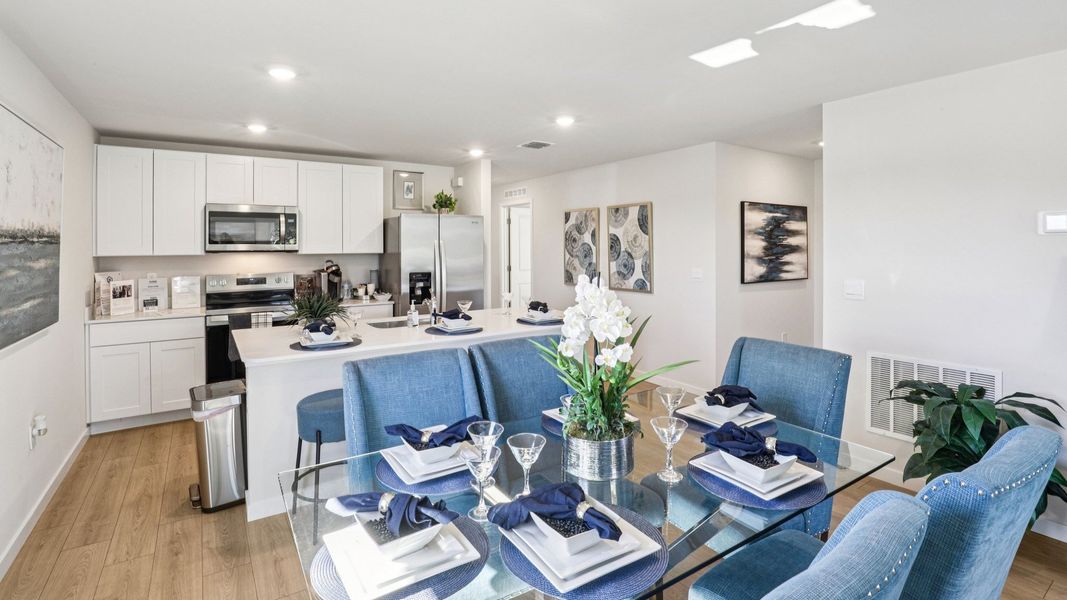 Furnished interior in a model home at Asher Park in Lehigh Acres (Image 17).