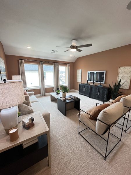 A cozy, stylish living room with modern furnishings, soft lighting, and a neutral color palette.