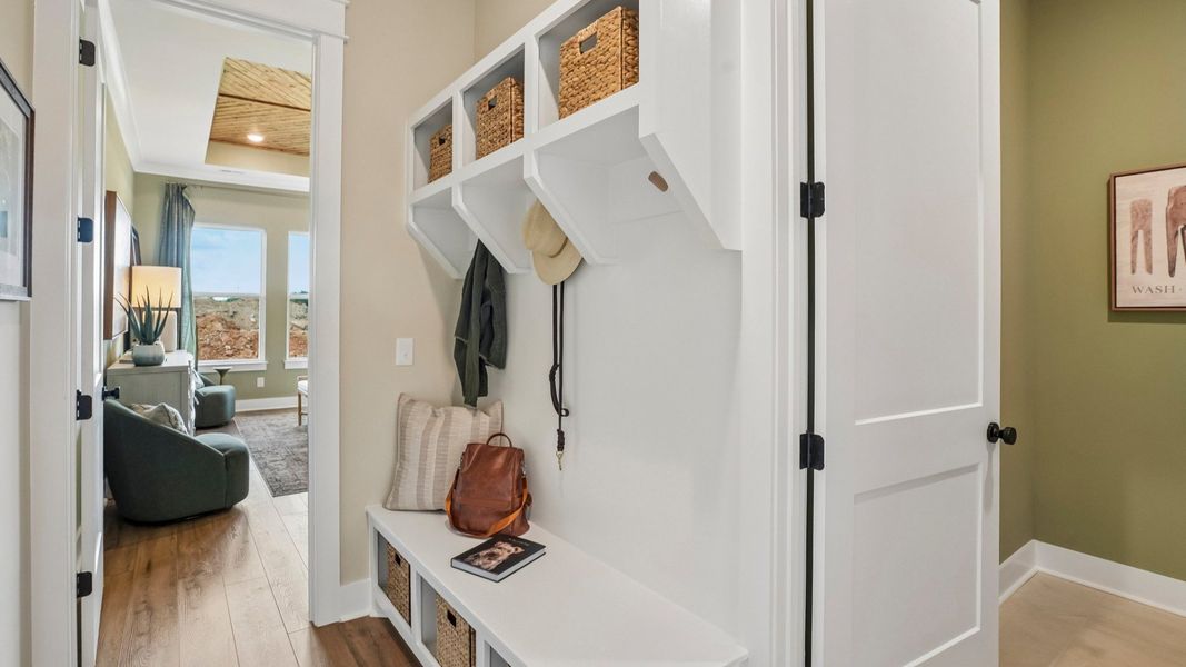 Dedicated drop-zone with access to laundry room and primary suite Dedicated drop-zone with access to laundry room and primary suite