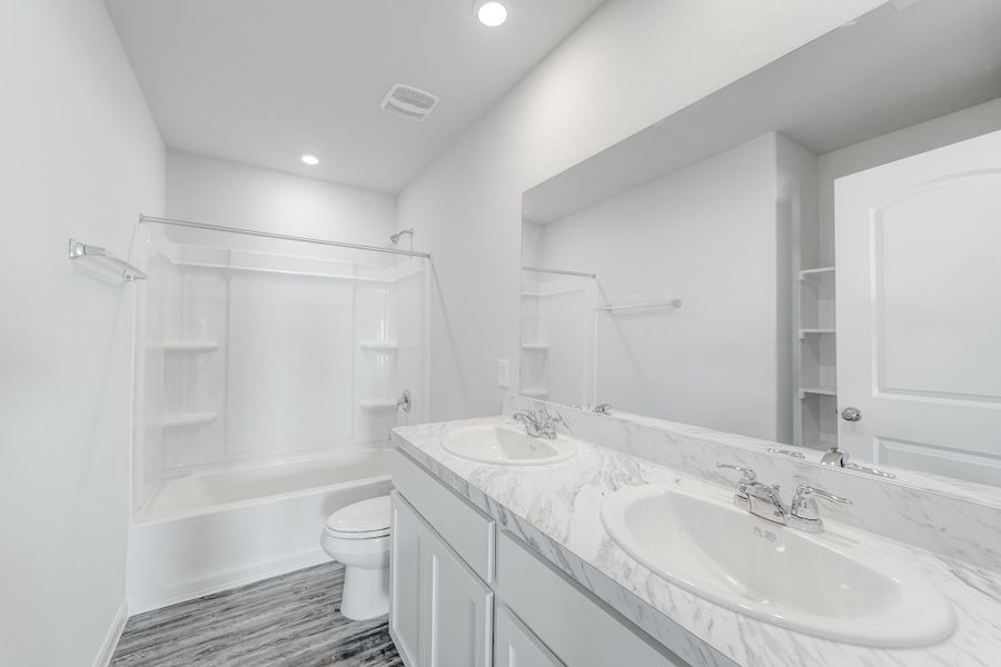 Furnished interior in a model home at Whispering Winds in Alvord (Image 4).