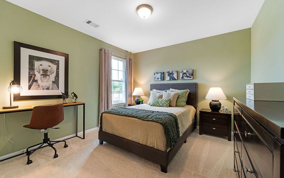 Furnished interior in a model home at The Pines at Seven Coves in Willis (Image 31).