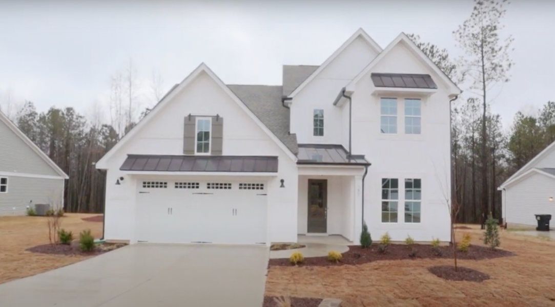 Front exterior of a home in the WyndWater community, located in Hampstead, NC (Image 8).