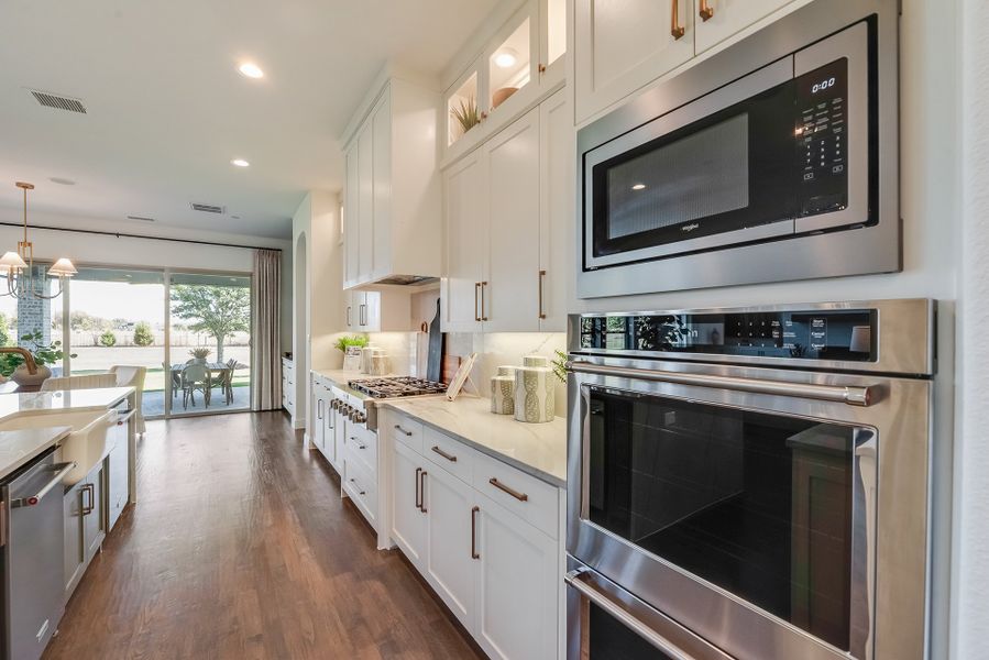 Furnished interior in a model home at King's Crossing in Parker (Image 6).