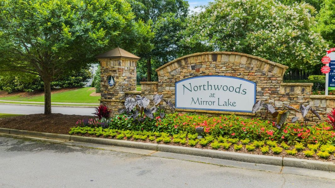 Entrance to the Northwoods at Mirror Lake community in Villa Rica, GA, featuring signage and landscaping (Image 1).
