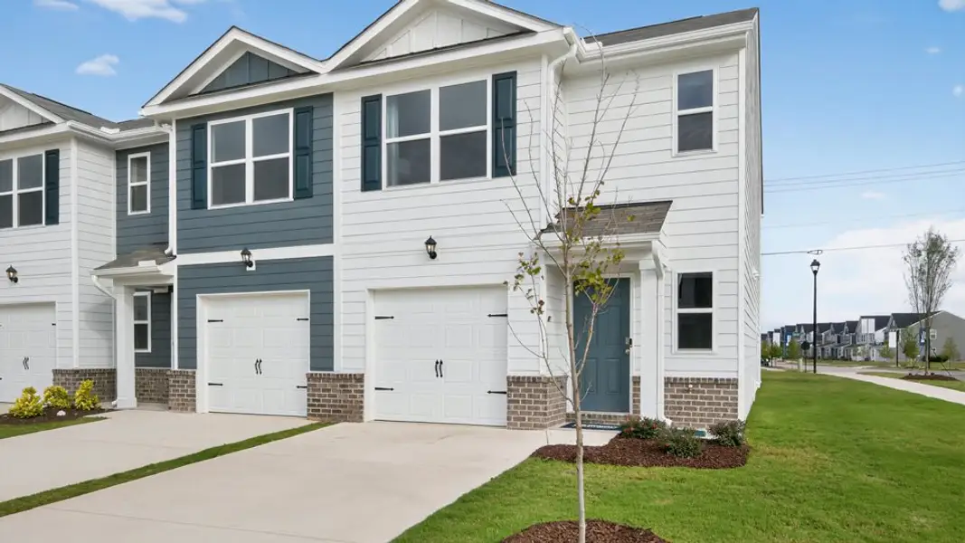 Front exterior of a home in the The Townes at Wilson's Ridge community, located in Wilson's Mills, NC (Image 4). Front exterior of a home in the The Townes at Wilson's Ridge community, located in Wilson's Mills, NC (Image 4).