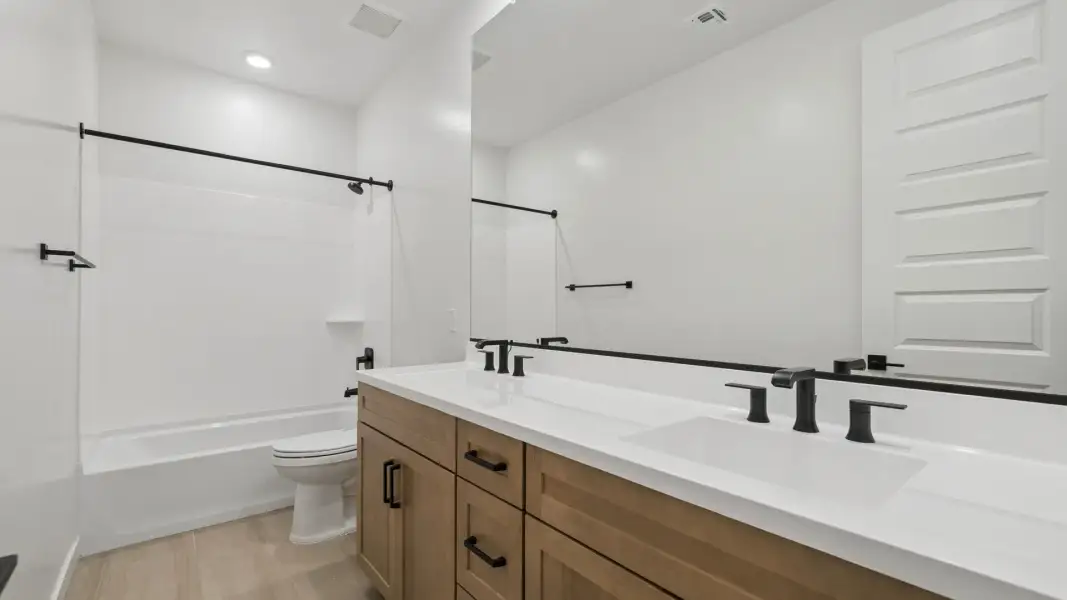 Furnished interior in a model home at Oak Park Manor Signature Homesites in Phoenix (Image 18).