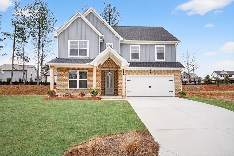 Front exterior of a home in the The Fairways at Mirror Lake community, located in Villa Rica, GA (Image 4). Front exterior of a home in the The Fairways at Mirror Lake community, located in Villa Rica, GA (Image 4).