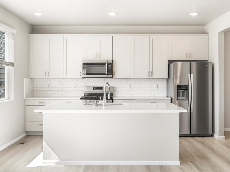 Waterton floorplan interior image taken at a Meritage Homes community in Brighton, CO.