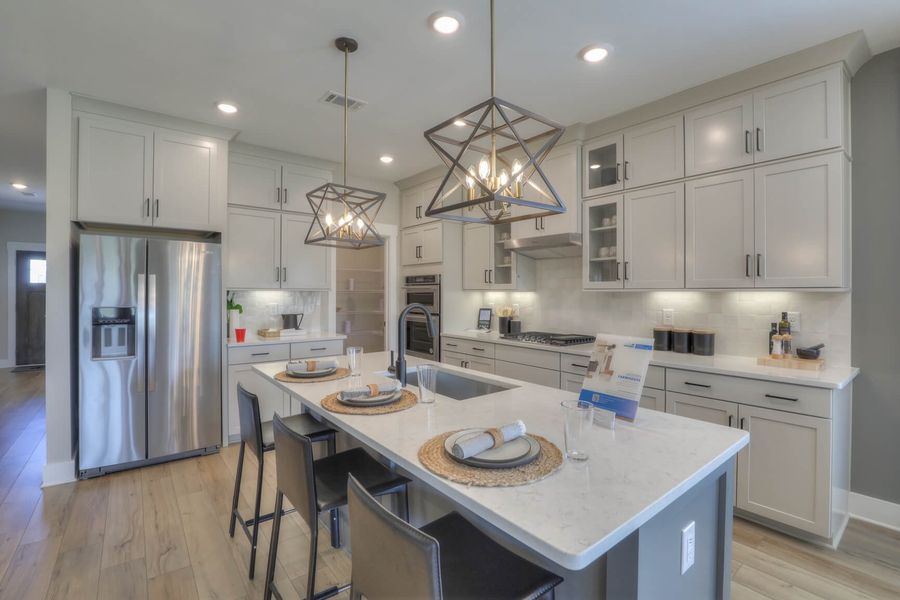 Cooking meals for your family is made easy with plenty of counterspace and a large island.