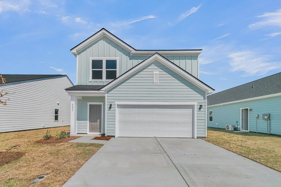 Front exterior of a home in the Tea Farm community, located in Ravenel, SC (Image 4).