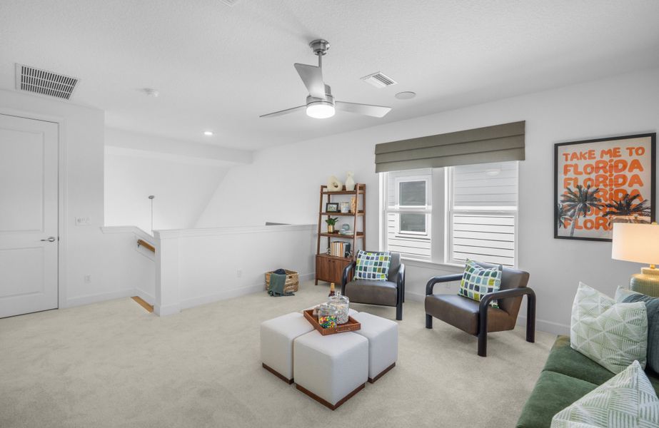 Furnished interior in a model home at Mariposa at EverRange in Jacksonville (Image 21).