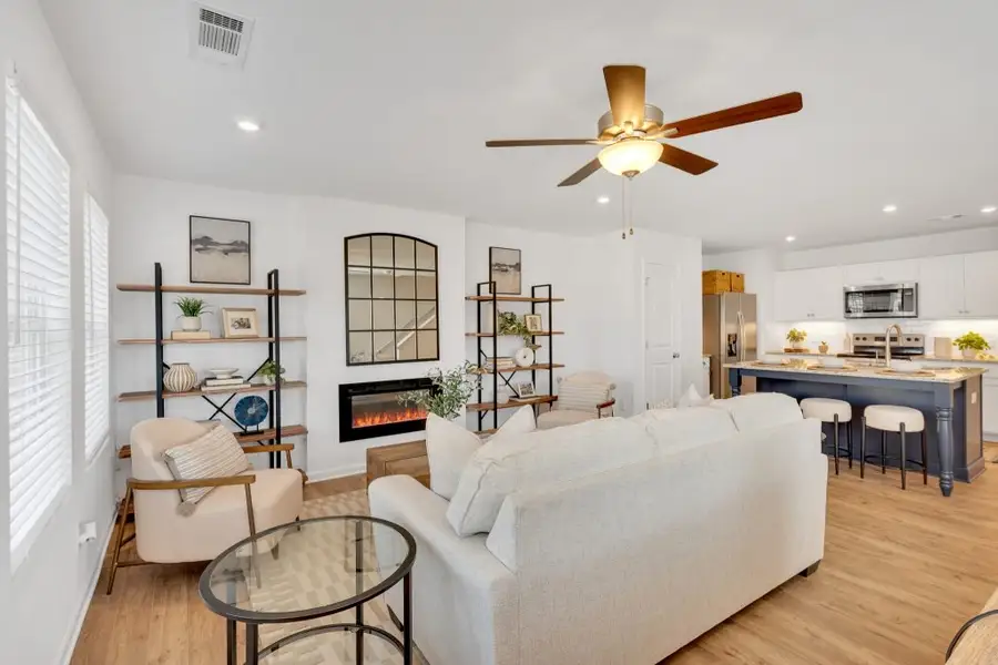 Furnished interior in a model home at Village Green in Adairsville (Image 4).