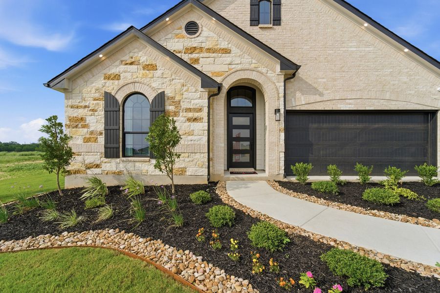 Front exterior of a home in the Hickory Ridge Estates community, located in Elmendorf, TX (Image 11).