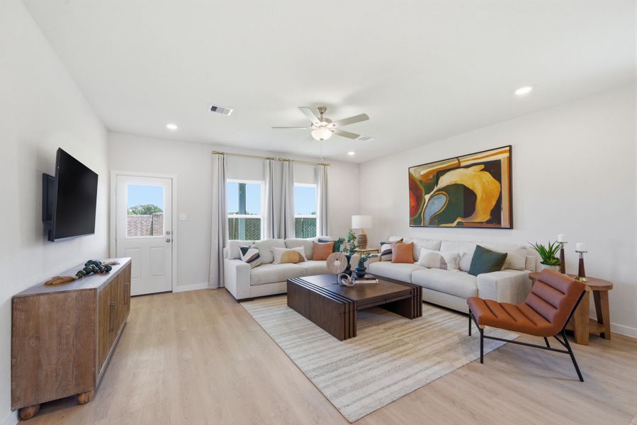 A living room with a wood floor. A living room with a wood floor.