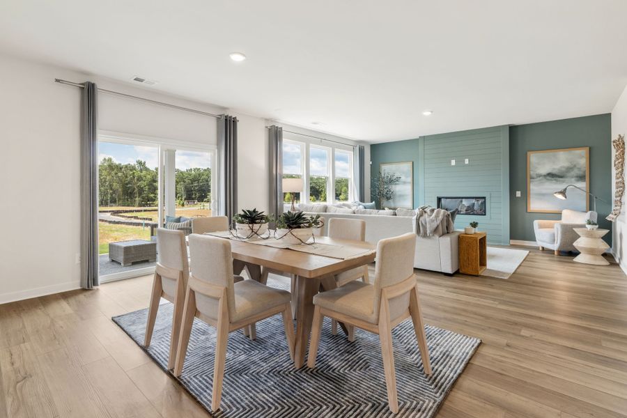 A dining room with a large table.