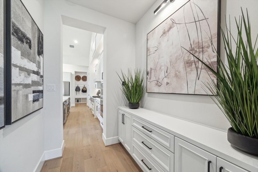 Furnished interior in a model home at The Woodlands Hills – 65' in Willis (Image 13).