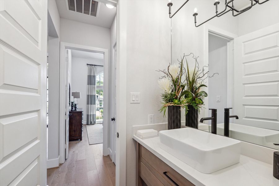 Furnished interior in a model home at The Woodlands Hills – 65' in Willis (Image 19).
