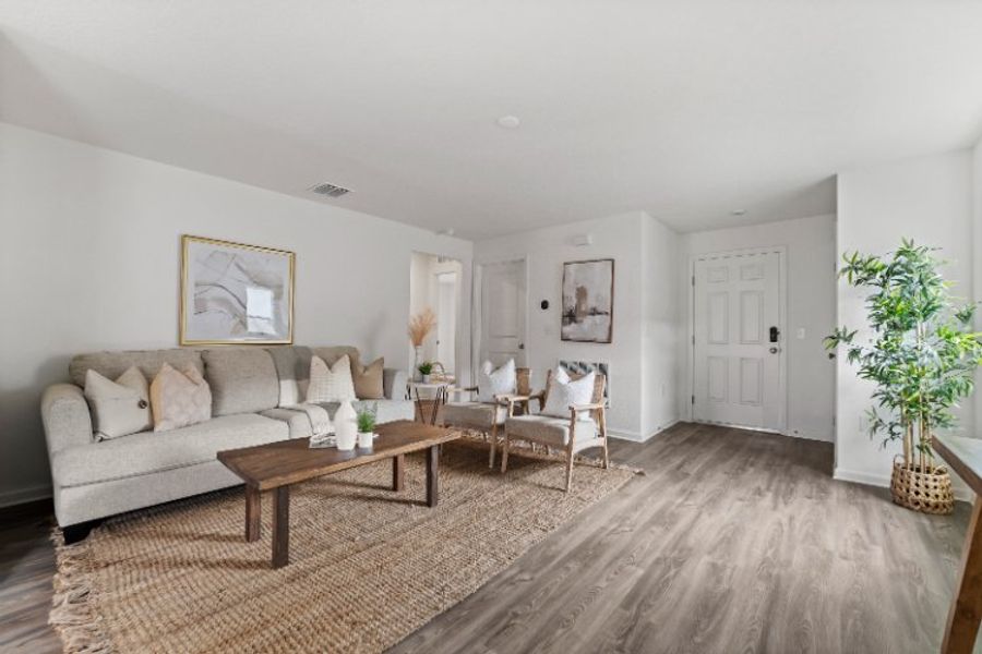 A living room with a couch and a coffee table.