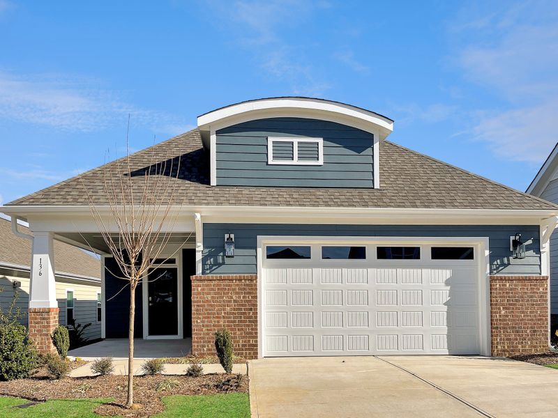 Front exterior of a home in the The Walk at East Village community, located in Clayton, NC (Image 25). Front exterior of a home in the The Walk at East Village community, located in Clayton, NC (Image 25).