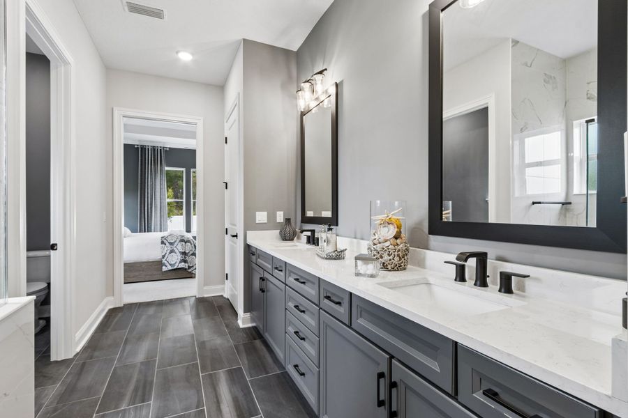 Furnished interior in a model home at Sandy Bluff in Yulee (Image 29).
