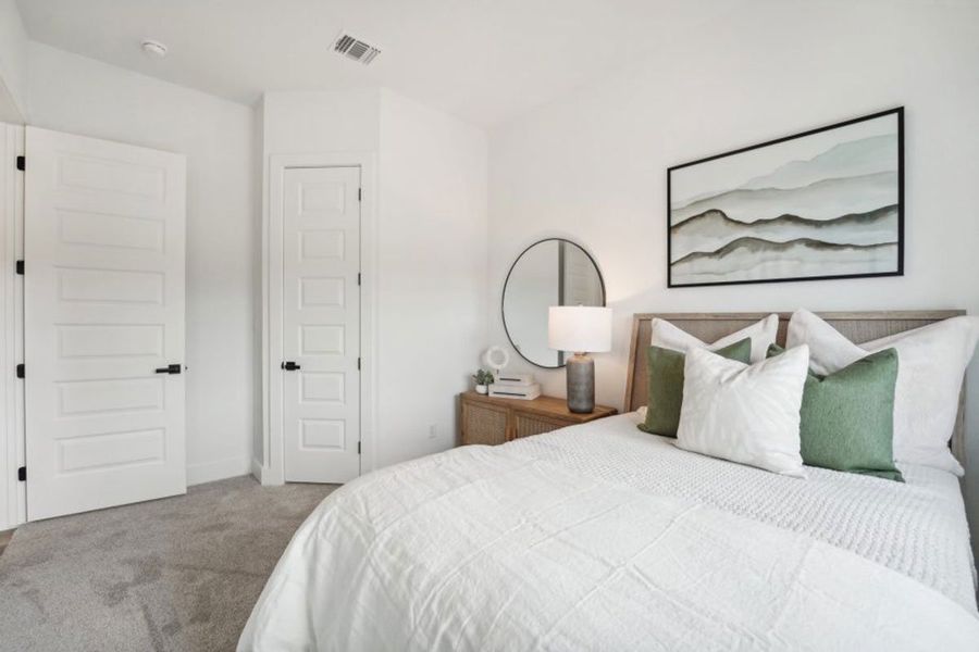 Furnished interior in a model home at Grande Estates in Bertram (Image 7).