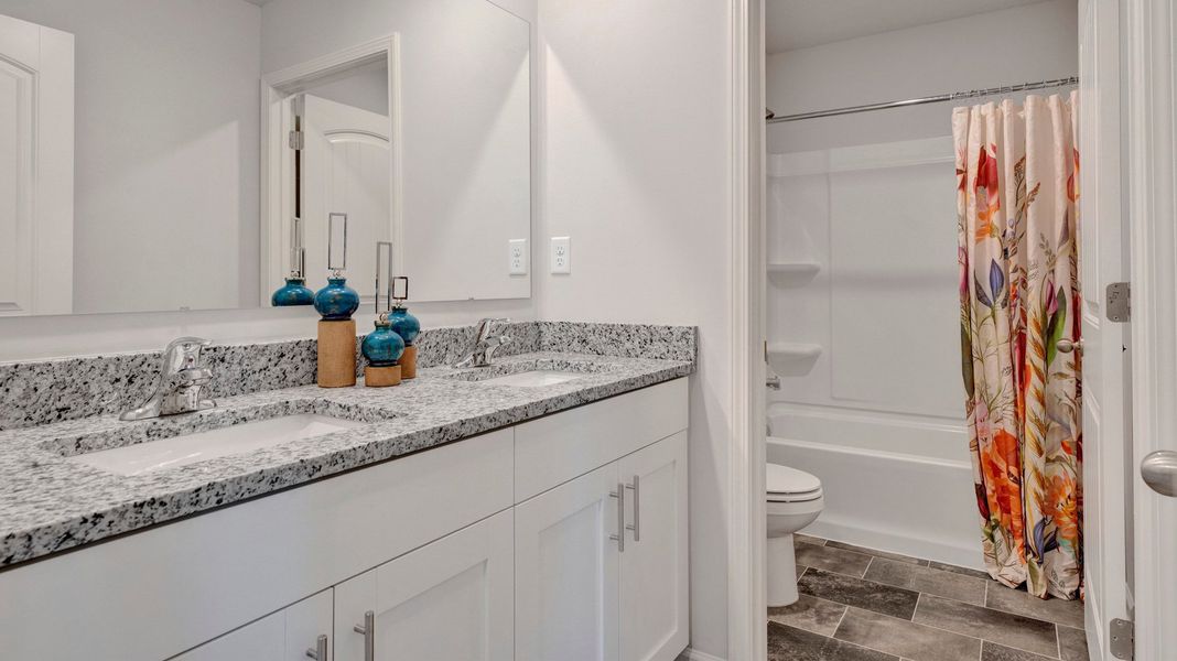 Furnished interior in a model home at Riverwood Gardens in Oakland (Image 44).