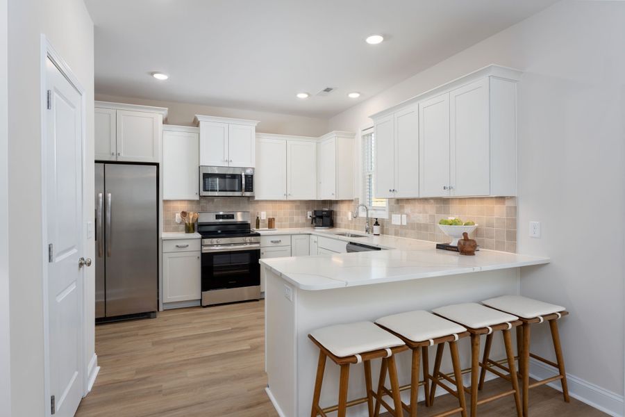 Furnished interior in a model home at Homesteads at Point Caswell in Columbia (Image 4).