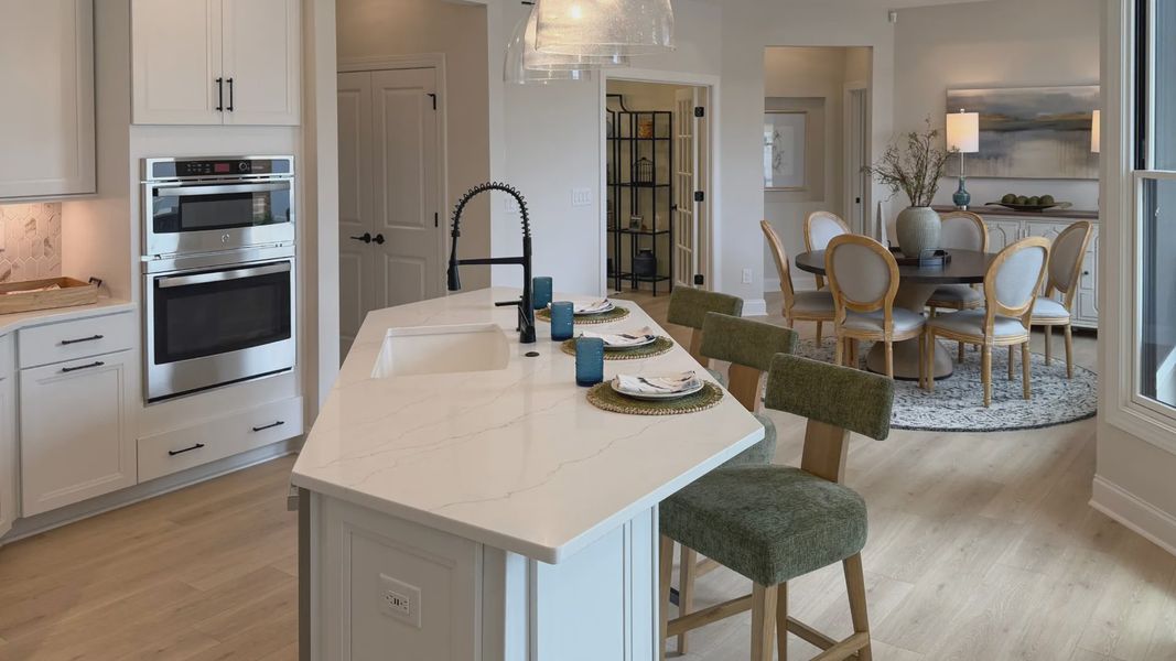 Furnished interior in a model home at The Courtyards at Hodges Farm in Charlotte (Image 39).