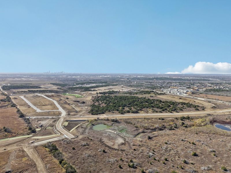 A landscape with a road and trees.
