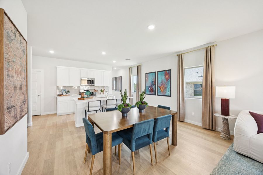 Dining Room in a Belmont Magnolia Model Home in Aubrey TX by Trophy Signature Homes Dining Room in a Belmont Magnolia Model Home in Aubrey TX by Trophy Signature Homes