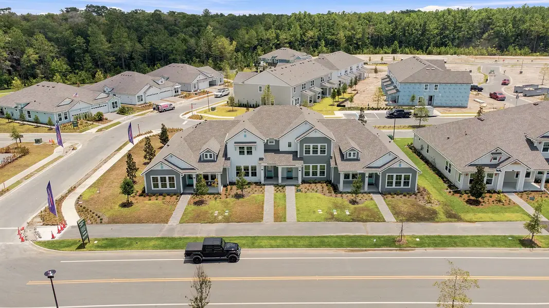 Aerial view of the Westerly Park at Wildlight - Courtyard Collection community in Yulee, FL, showing layout and nearby surroundings (Image 8). Aerial view of the Westerly Park at Wildlight - Courtyard Collection community in Yulee, FL, showing layout and nearby surroundings (Image 8).