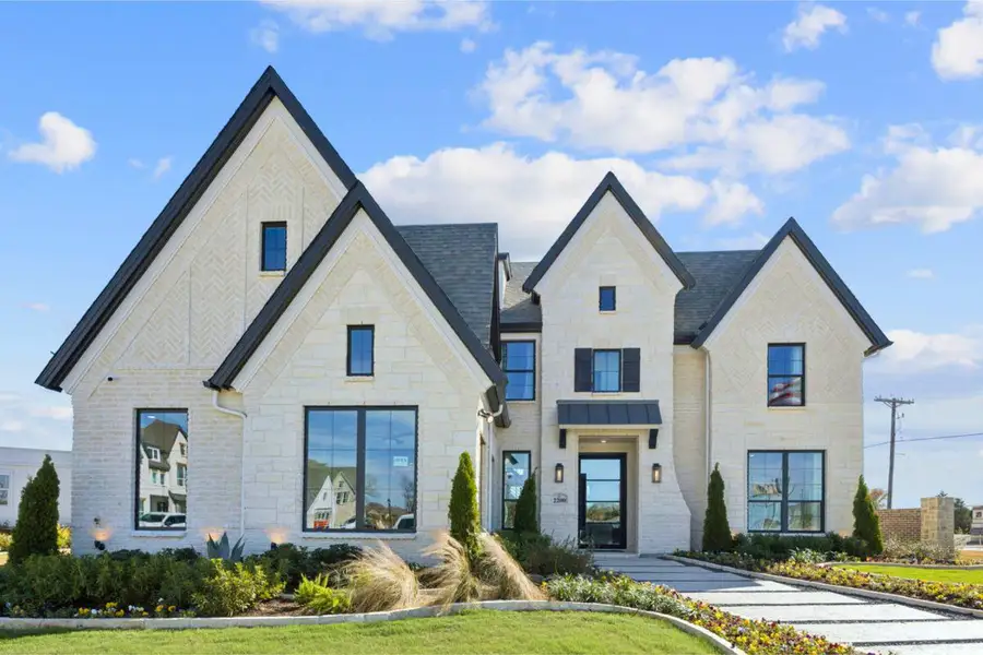 Front exterior of a home in the Grand Estates of Anna community, located in Anna, TX (Image 1).