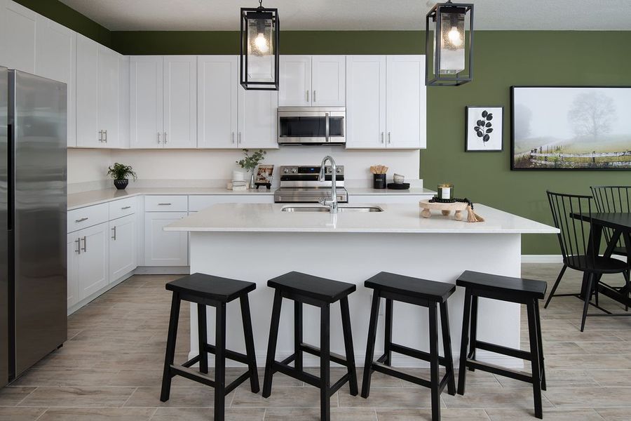 Furnished interior in a model home at Highfield at Twisted Oaks in Wildwood (Image 40).