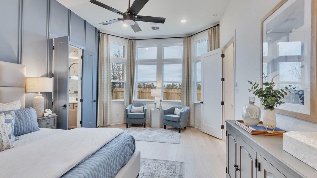 Discover tranquility in this Spring Creek bedroom with exquisite bay windows and serene blue accents.
