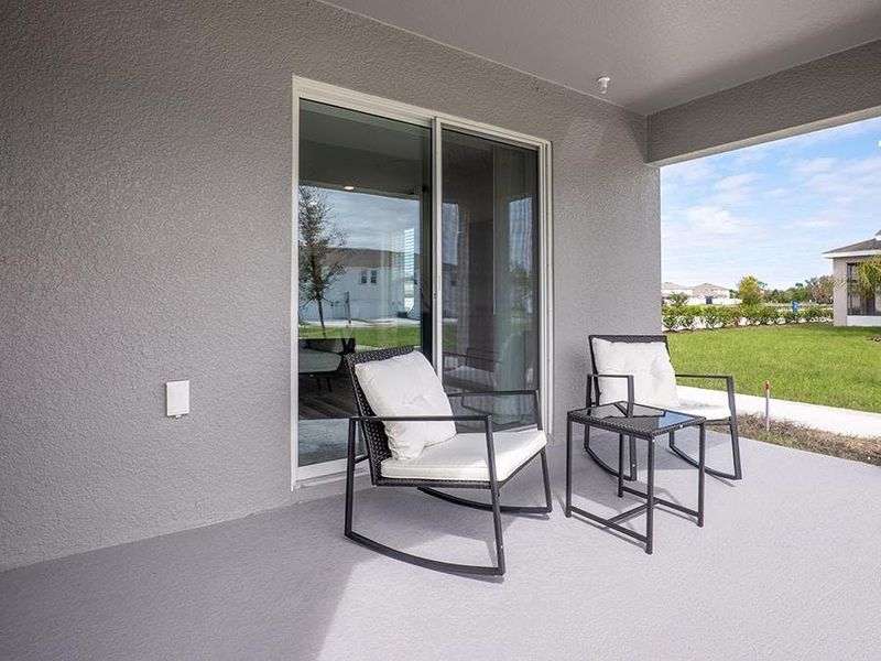 Select homes include a covered lanai, providing desirable outdoor living space - Daisy townhome model in St. Cloud, FL