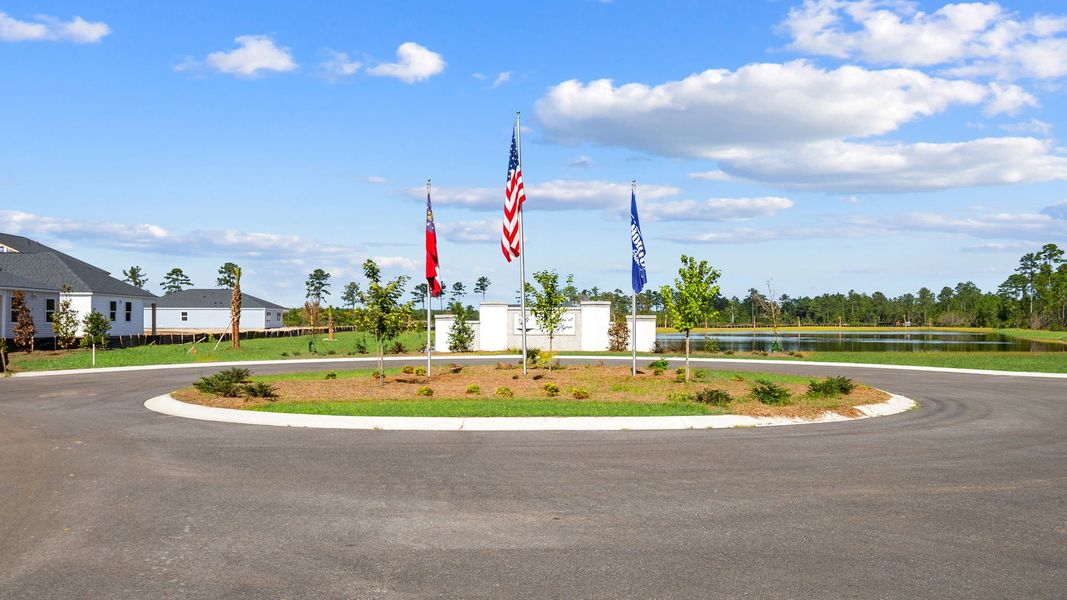 Entrance to the The Lakes at North Glynn community in Brunswick, GA, featuring signage and landscaping (Image 11).