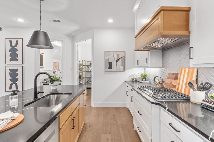 Plan 1406 Kitchen - Mosaic 40s Model - Photo by American Legend Homes