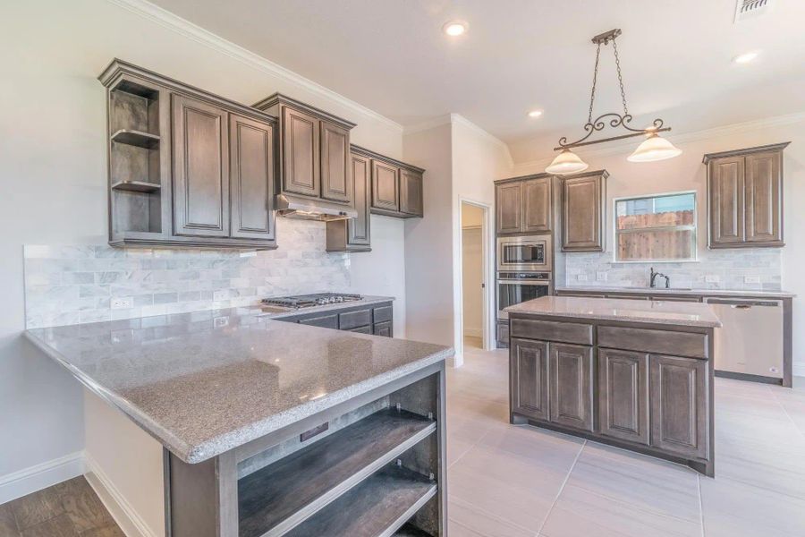 Kitchen | Concept 2027 at Coyote Crossing in Godley, TX by Landsea Homes