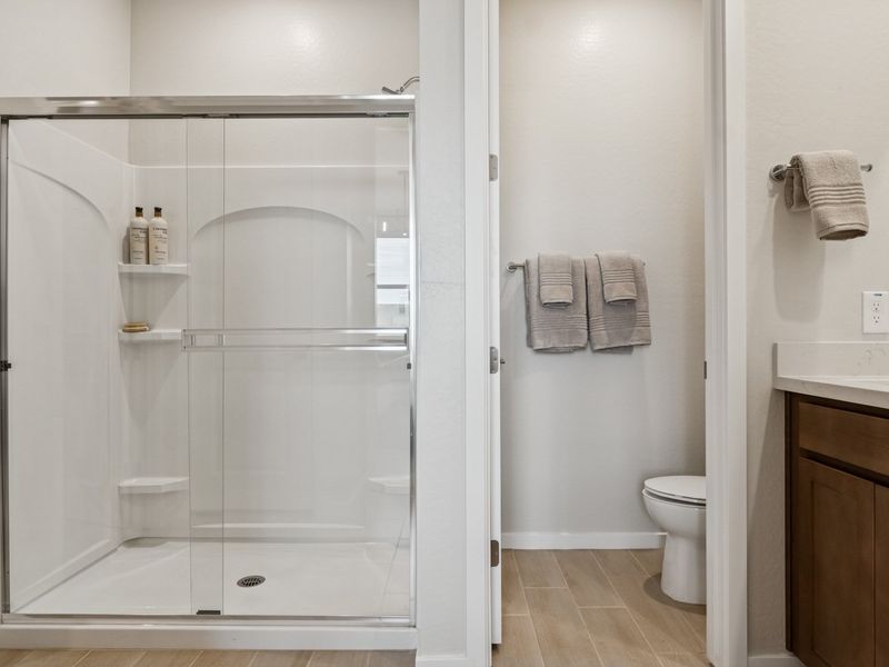 A bathroom with a glass shower.