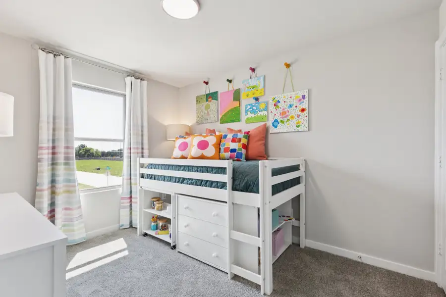 REPRESENTATIVE PHOTO – Bedroom in a Nicholson Ranch new home in Lavon TX by Trophy Signature Homes