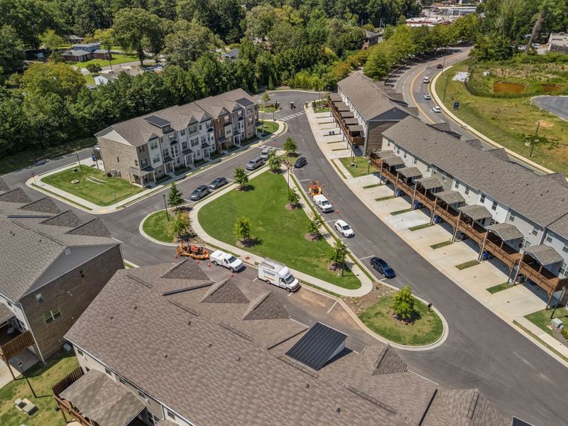Aerial view of the Towns at Enclave community in Lawrenceville, GA, showing layout and nearby surroundings (Image 13). Aerial view of the Towns at Enclave community in Lawrenceville, GA, showing layout and nearby surroundings (Image 13).