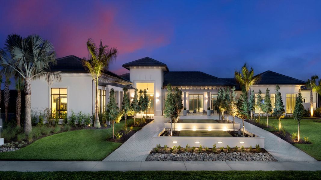 Front exterior of a home in the Vistera of Venice Real Estate and Homes for Sale in Venice, FL - Neal Communities community, located in Nokomis, FL (Image 4).