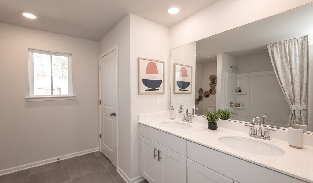 Mornings will be a breeze with dual sinks in the secondary bathroom.